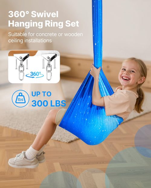 Smiling child in blue sensory swing hammock, 360° swivel ceiling mount, supports up to 300 lbs.