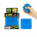 Blue squeeze cube with packaging and a hand holding it