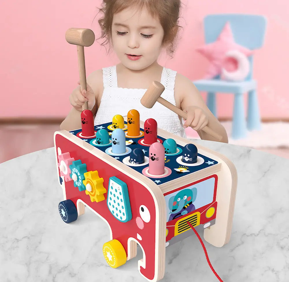 Child playing with a colorful wooden toy