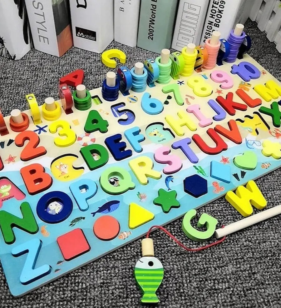 Colorful alphabet and number puzzle on a wooden board with fishing rod toy