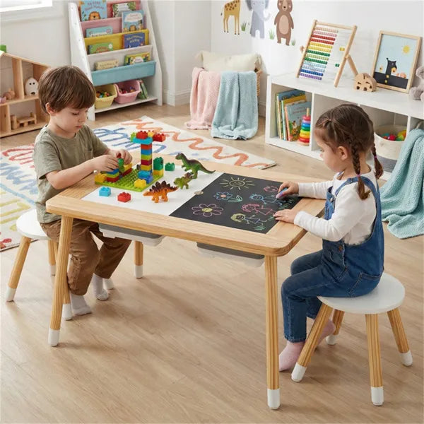 Wooden sensory activity table with two stools, water, sand, rubber ducks, and building blocks